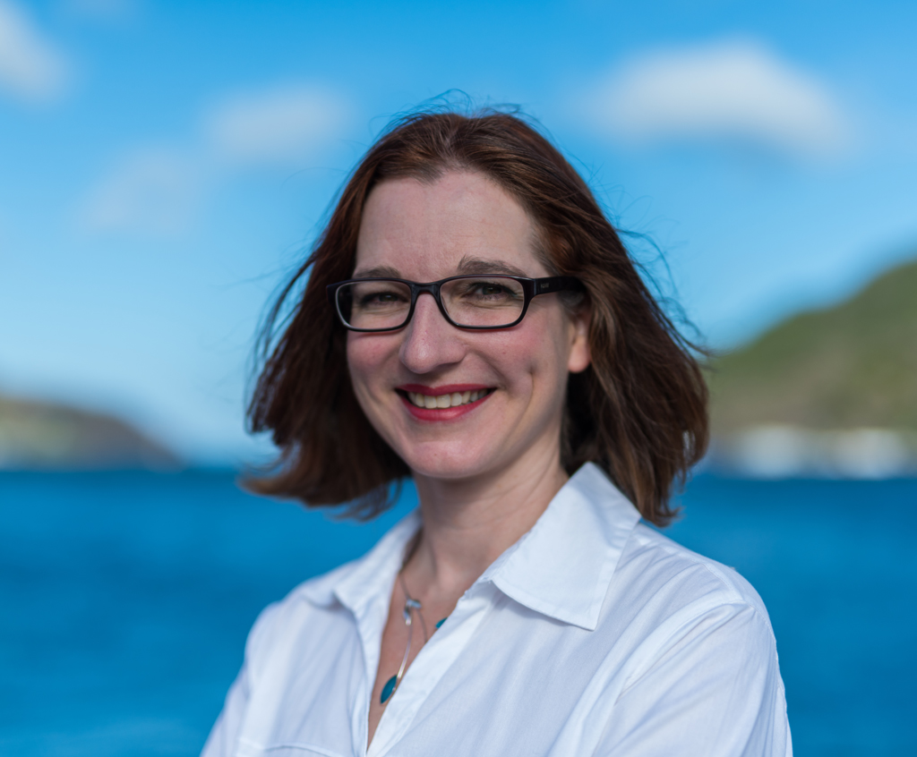 jazz mediator, janet tucker smiling happily in front of the lake